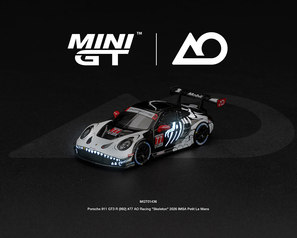 [Pre-Order] Mini GT Porsche 911 GT3 R (992) #77 AO Racing “Skeleton Rexy” 2026 IMSA Petit Le Mans – (Glow in the Dark)